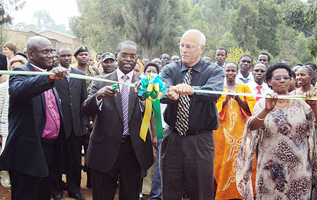 Dr. Matthias Harebamungu cutting the ribbon to commission new structures (Photo; D. Sabiiti)