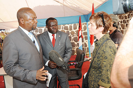 RPF Vice Chairman Christopher Bazivamo (C) and Spokesperson of RPF campaign Committee Wellars Gasamagera talking to a foreign Journalist on Friday. (Photo J Mbanda)