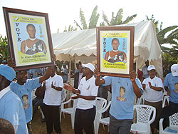 PPC supporters display posters of their candidate at the partyu2019s first rally in Rwamagana yesterday (Photo; S. Rwembeho)