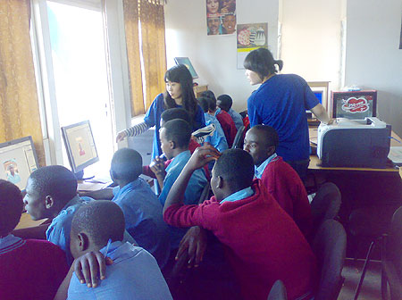 South Korean volunteers conducting IT training to students of Academy de La Salle at Gicumbi telecenter last Friday. (Photo:  A.Gahene)