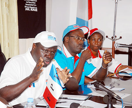 Christophe Bazivamo (L) briefs the press as Ndayisaba(C) and inyumba look on, yesterday. (Photo/ F. Goodman)