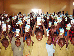 Pupils displaying pints of milk at one of the schools benefiting from the programme (Courtesy photo)