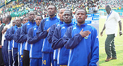 Members of the U-20 national soccer team sing the national anthem during last yearu2019s AYC played in Kigali, while Sellas Tetteh (far right) has a tough assignment ahead for him.