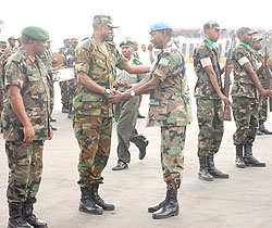 Brig. Gen Jean Bosco Kazura welcoming RDF offices from a peacekeeping mission yesterday at Kigali International Airport (Photo; F. Goodman)