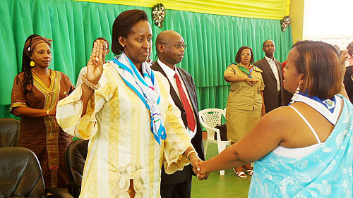u2018Once a Guide, always a Guideu2019. Mrs. Jeannette Kagame takes a guides salut with AGR boss Alexia Nkurunzinza yesterday (Courtsey Photo)