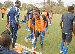 APR and Rwandau2019s U-20 striker Emmanuel Sebanani (C) seem to enjoy himself after Mondayu2019s training session at Kicukiro ground. (Photo: F. Goodman)
