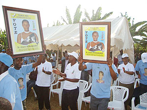 PPC supporters carrying posters of their candidate. (Photo /  S. Rwembeho)