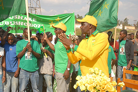 PL Presidential candidate, Prosper Higiro, leads party supporters through a party song during his rally in Gisozi (Photo F Goodman)