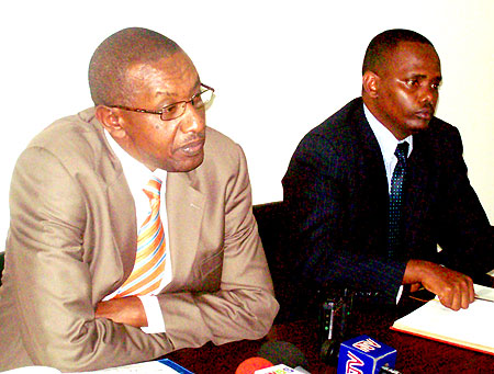 Rwandau2019s High Commissioner to Uganda, Frank Mugambage, (left) and the First Councillor, Dan Mutezintare, addressing the press yesterday (Photo: G. Muramira)