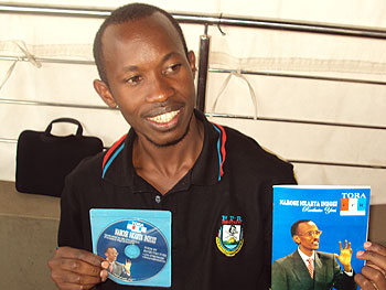 Yves Rwibutso shows off his u201cNarose Nkabya Inzoziu201d book. (photo, by L. Mbabazi).
