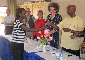 One of the participants being awarded a certificate ( Photo by Ninsiima Innocent)