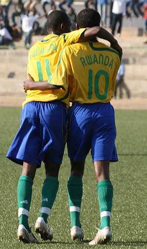 Jean Claude Iranzi celebrates with Jamal Mwiseneza after he set-up Kipson Atuh eireu2019s first goal in the first half. (Photo/ G. Kirenga)