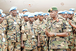 The Chief of Staff of Land Forces, Lt Gen. Ceasar Kayizari, with soldiers of the 73rd battalion on their arrival from Darfur (Photo: J Mbanda)