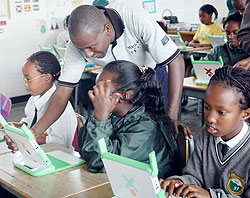 Primary School pupils with laptops acquired under the One Laptop Per Child Programme. Teachers will  soon also benefit from a similar programme (File Photo)