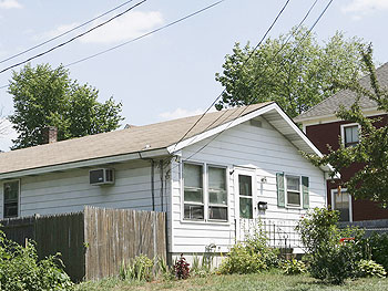 Beatrice Munyenyezi, 40, came to the U.S. in 1999 and lived in this home in Manchester, N.H. Federal prosecutors say Munyenyezi directed kidnapping, rape and murder during the 1994 Rwanda genocide.