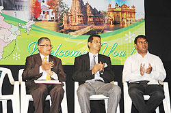 Raj Rajendran Munyaneza (L) Chairman of the Indian community with Denesh Kalyani, (Vice chair) and Shivdas Puthiyedath the treasurer ( Photo  F. Goodman )