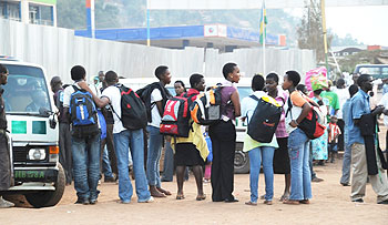 Students waiting to board busses to school, yesterday after a two-week holiday (Photo F Goodman)