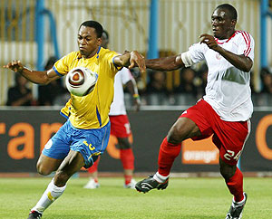 Nigerian player Heartland FC Derick Amadi (R) challenges Edwin of Ismailiy of Egypt during their African Champions League football match in Ismailia.