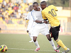 Sula Matovu of Uganda (R) is a tackled by Eric Rutanga of Rwanda during their Cecafa Under 20 tie at Asmara Stadium on Monday. Uganda beat Rwanda 3-1. (Photo / Cecafa)