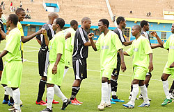 APR and KIYOVU players greet each other before last seasonu2019s game at Amahoro stadium. The two rivals meet today in the second semi finals of pre-season Primus cup. (File photo)