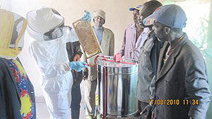 Cooperative members admiring the new  honey extractor machine . (Photo: D. Ngabonziza)