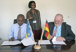 RBS boss Dr. Mark Bagabe (L) and Thomas Bedenbecker of GTZ signing the MoU yesterday (Courtesy photo)