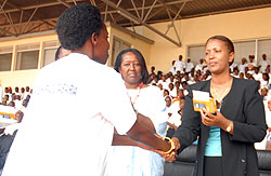 KCCu2019s deputy Mayor, Jeanne du2019Arc Gakuba, handing over a phone to a health worker recently (File photo)