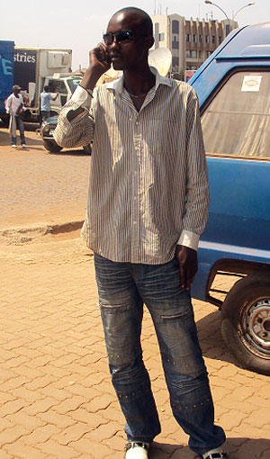 Theogene Civiringa, waits for a client. He does most of his work on phone. (Photo / G. Mugoya)