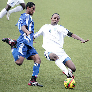 Rwandau2019s Emery Bayisenge clears the ball from Zanzibar opponent Ali Badru in a match they drew 1-1. (Photo: Cecafa)