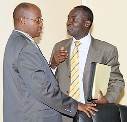 Ministers James Musoni (L) and Stanislas Kamanzi after the meeting yesterday