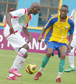 Migi (R) during last yearu2019s Africa Youth Championships. The midfielder flew to Germany last night. (File Photo)