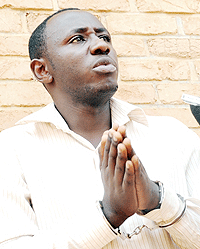 IN CUSTODY; Anicet Korabwangu in hand cuffs after he was arrested (Photo J Mbanda).
