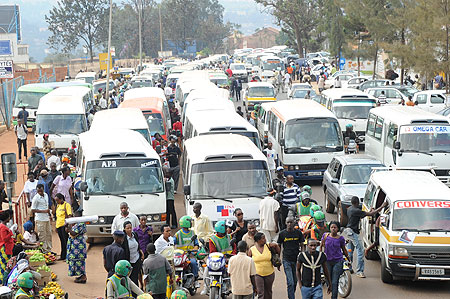 Commuter transporters queue up to pick passengers at Kwa Rubangura terminal. Passengers have expressed mixed feeling on new rates (File Photo)