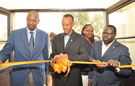 President Kagame commissions the factory yesterday as Kari Gahiga (L), the chairman of Roka Rwanda and Christophe Bazivamo, Minister of Mines (R), look on .(Photo Village Urugwiro)