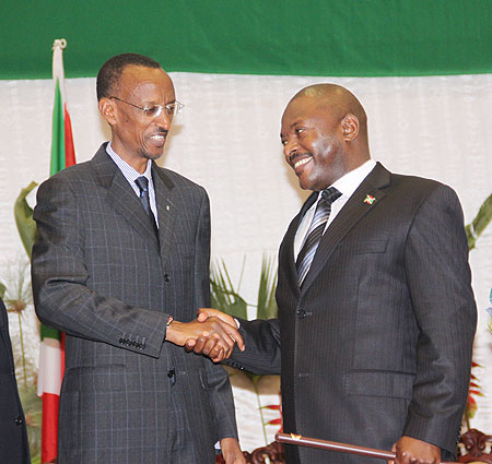 President Paul Kagame congratulates his Burundian counterpart, President Pierre Nkurunziza, at the swearing-in ceremony in Bujumbura, yesterday