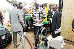 Prime Minister Bernard Makuza (C) being shown around the Expo grounds yesterday (Photo: J. Mbanda).