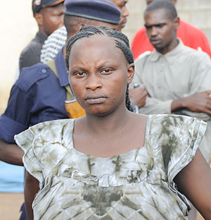 Sandrine Abijuru being led away by police yesterday (Photo: J. Mbanda)