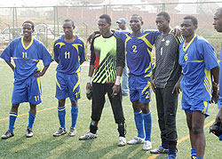 Amavubi players take a breather after Mondayu2019s training session. They left this morning for Abidjan. (Photo: E. Niyonshuti)