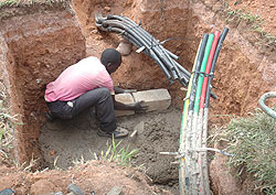 A Man lays Fibre Optic cables. Government has announced that works on  the rollout have reached 50 percent (File Photo)