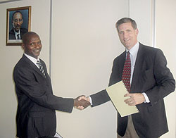 Sopyrwa boss Gabriel Bizimungu and Steven M Gullickson after the signing yesterday (Photo / A. Ngarambe)