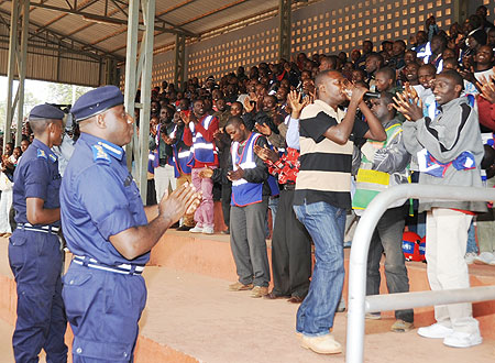 Police Chief, Gasana, with the taxi-moto riders, yesterday (Photo / F. Goodman)