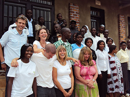 MAD4Africa crew pose  for a group photo with residents of Ngoma sector at the new center in Nyaruguru district.Photo D.Sabiiti