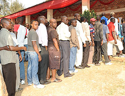 People queue up to vote in the just-concluded presidential polls. NEC plans to conduct local leaders polls early next year (File Photo)