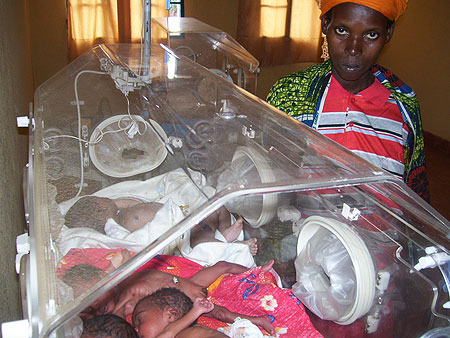 Nyiraromba stands near her three children at Byumba hospital. (Photo A. Gahene)
