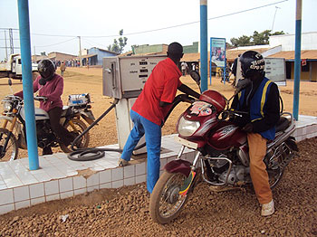 A motorcyclists refuels at the newly opened fuel station at Nyaruguru (Photo: JC. Gakwaya)