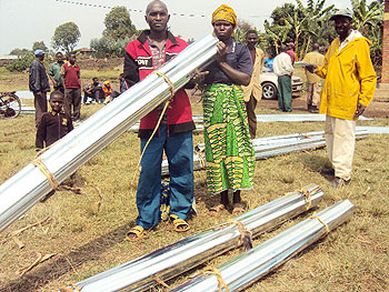 At least 37 residents of Rugarama sector received iron sheets for constructing better houses. (Photo / B. Mukombozi)