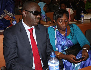 EALA member Dr. James Ndahiro with another EALA member during the session yesterday in Bujumbura (Courtesy photo)