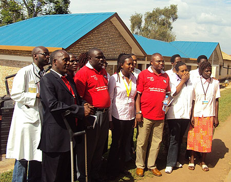 Members of GCAP pose for a group photo with hospital staff (Photo; P. Ntambara)
