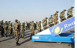 A cross section of RDF soldiers boarding a plane for Khartoum at Kigali Airport yesterday (Photo; T. Kisambira)