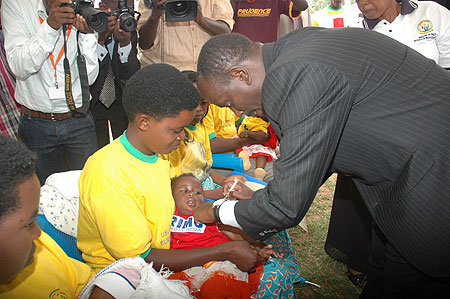 Health Minister Dr. Richard Sezibera taking part in the Immunisation exercise in Gashora recently.(File photo)